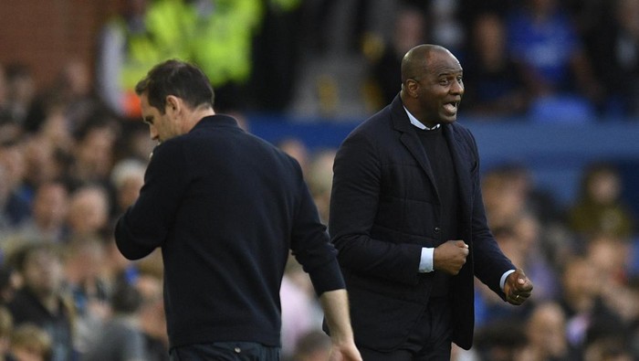 Evertons English manager Frank Lampard (L) and Crystal Palaces French manager Patrick Vieira react during the English Premier League football match between Everton and Crystal Palace at Goodison Park in Liverpool, north west England on May 19, 2022. - RESTRICTED TO EDITORIAL USE. No use with unauthorized audio, video, data, fixture lists, club/league logos or live services. Online in-match use limited to 120 images. An additional 40 images may be used in extra time. No video emulation. Social media in-match use limited to 120 images. An additional 40 images may be used in extra time. No use in betting publications, games or single club/league/player publications. (Photo by Oli SCARFF / AFP) / RESTRICTED TO EDITORIAL USE. No use with unauthorized audio, video, data, fixture lists, club/league logos or live services. Online in-match use limited to 120 images. An additional 40 images may be used in extra time. No video emulation. Social media in-match use limited to 120 images. An additional 40 images may be used in extra time. No use in betting publications, games or single club/league/player publications. / RESTRICTED TO EDITORIAL USE. No use with unauthorized audio, video, data, fixture lists, club/league logos or live services. Online in-match use limited to 120 images. An additional 40 images may be used in extra time. No video emulation. Social media in-match use limited to 120 images. An additional 40 images may be used in extra time. No use in betting publications, games or single club/league/player publications. (Photo by OLI SCARFF/AFP via Getty Images)