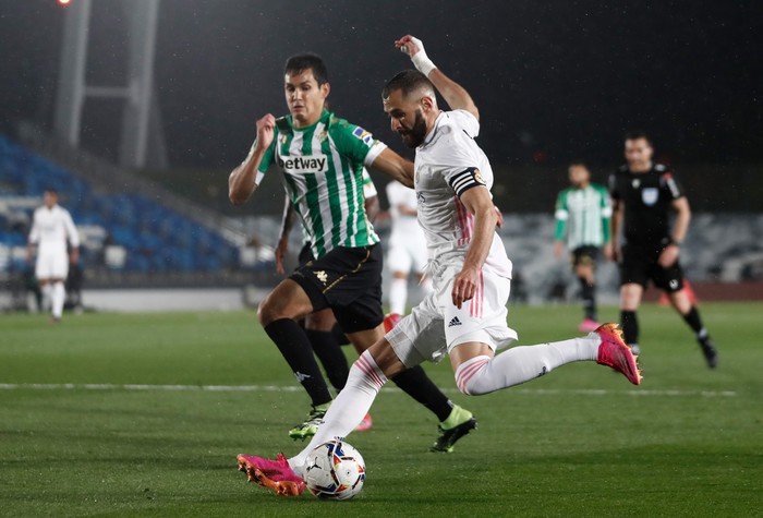 MADRID, SPAIN - APRIL 24: Karim Benzema on Real Madrid in action during the La Liga Santander match between Real Madrid and Real Betis at Estadio Santiago Bernabeu on April 24, 2021 in Madrid, Spain. Sporting stadiums around Spain remain under strict restrictions due to the Coronavirus Pandemic as Government social distancing laws prohibit fans inside venues resulting in games being played behind closed doors. (Photo by Helios de la Rubia/Real Madrid via Getty Images)