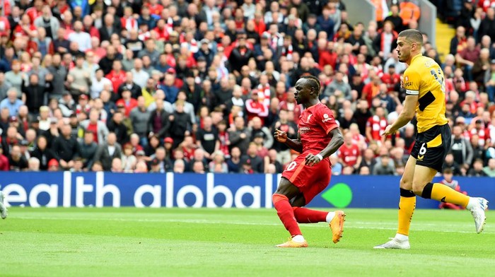 LIVERPOOL, ENGLAND - MAY 22: (THE SUN OUT, THE SUN ON SUNDAY OUT) Sadio Mane of Liverpool scoring the opening goal  during the Premier League match between Liverpool and Wolverhampton Wanderers at Anfield on May 22, 2022 in Liverpool, England. (Photo by Andrew Powell/Liverpool FC via Getty Images)