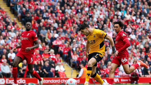 LIVERPOOL, ENGLAND - MAY 22: Pedro Neto of Wolverhampton Wanderers scores their sides first goal during the Premier League match between Liverpool and Wolverhampton Wanderers at Anfield on May 22, 2022 in Liverpool, England. (Photo by Alex Livesey/Getty Images)