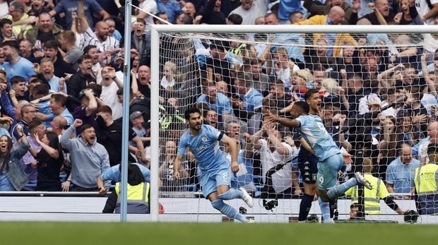 Soccer Football - Premier League - Manchester City v Aston Villa - Etihad Stadium, Manchester, Britain - May 22, 2022 Manchester City's Ilkay Gundogan celebrates scoring their third goal with Gabriel Jesus Action Images via Reuters/Jason Cairnduff EDITORIAL USE ONLY. No use with unauthorized audio, video, data, fixture lists, club/league logos or 'live' services. Online in-match use limited to 75 images, no video emulation. No use in betting, games or single club /league/player publications.  Please contact your account representative for further details.