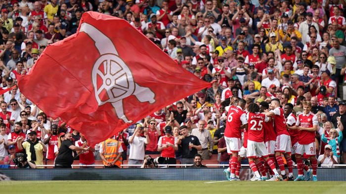 Arsenals Cedric Soares is mobbed by team-mates after scoring their sides third goal during the Premier League match at The Emirates Stadium, London. Picture date: Sunday May 22, 2022. (Photo by Tim Goode/PA Images via Getty Images)