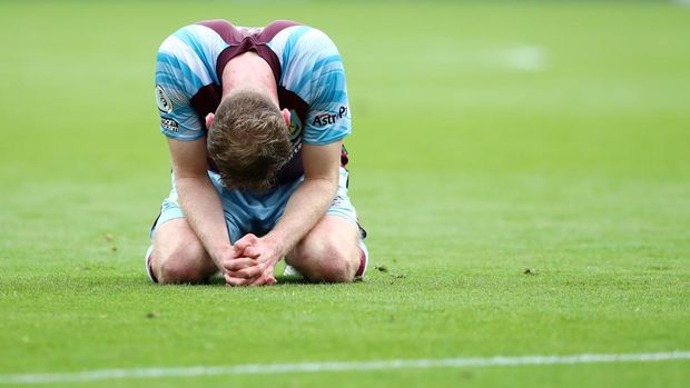 BURNLEY, ENGLAND - MAY 22: Nathan Collins of Burnley looks dejected following defeat and relegation to the Sky Bet Championship following the Premier League match between Burnley and Newcastle United at Turf Moor on May 22, 2022 in Burnley, England. (Photo by Jan Kruger/Getty Images)