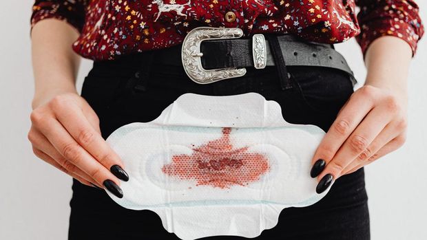 Ilustrasi darah menstruasi warna coklat