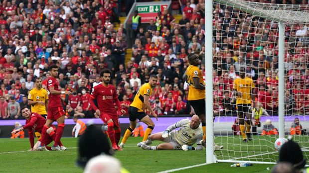 Liverpool's Andrew Robertson (left) scores their side's third goal of the game during the Premier League match at Anfield, Liverpool. Picture date: Sunday May 22, 2022. (Photo by Peter Byrne/PA Images via Getty Images)