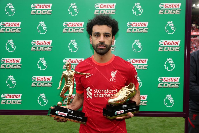 LIVERPOOL, ENGLAND - MAY 22: Mohamed Salah of Liverpool poses with the Castrol Playmaker Winner 2021/22 award and the Castrol Golden Boot award after the Premier League match between Liverpool and Wolverhampton Wanderers at Anfield on May 22, 2022 in Liverpool, England. (Photo by Julian Finney/Getty Images)