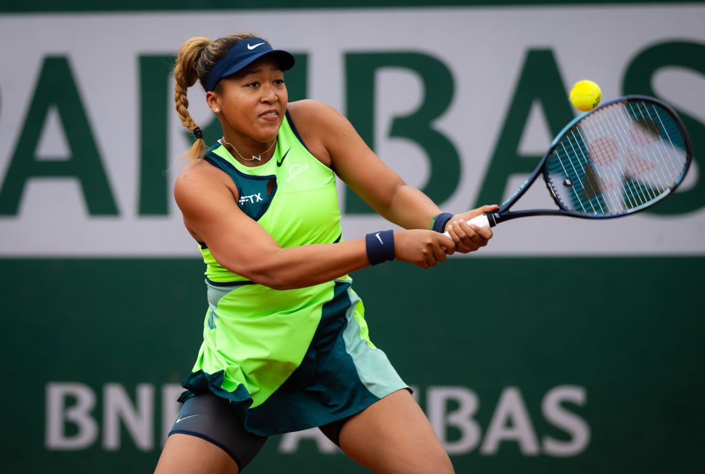 PARIS, FRANCE - MAY 23: Naomi Osaka of Japan in action against Amanda Anisimova of the United States in their Women's Singles First round match on Day 2 of the 2022 French Open at Roland Garros on May 23, 2022 in Paris, France (Photo by Robert Prange/Getty Images)