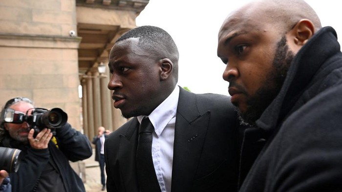 Manchester City and France international footballer Benjamin Mendy (C) arrives to Chester Crown Court for a pre-trial hearing in Chester, northwest England, on May 23, 2022. - Mendy, who has been charged with seven counts of rape, was freed on bail last month with 