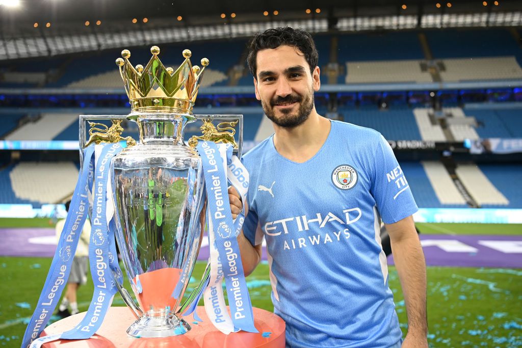 MANCHESTER, ENGLAND - MAY 22: Ilkay Guendogan of Manchester City celebrates with the Premier League trophy after their side finished the season as Premier League champions during the Premier League match between Manchester City and Aston Villa at Etihad Stadium on May 22, 2022 in Manchester, England. (Photo by Michael Regan/Getty Images)