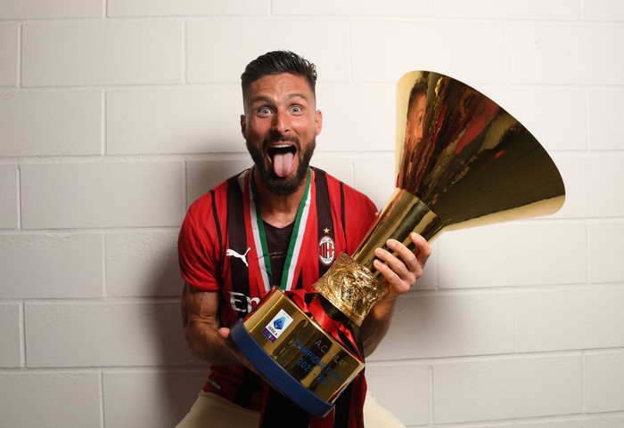 REGGIO NELLEMILIA, ITALY - MAY 22: Olivier Giroud of AC Milan poses with the trophy for the victory of 