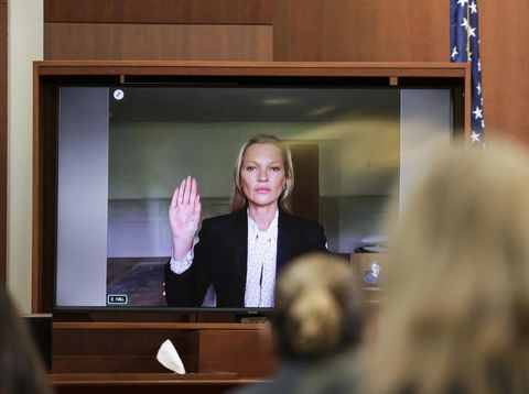 Kate Moss di Persidangan Johnny Depp Actor Johnny Depp listens as his former girlfriend, Model Kate Moss, testifies via video link at the Fairfax County Circuit Courthouse in Fairfax, Virginia, on May 25, 2022. - Actor Johnny Depp is suing ex-wife Amber Heard for libel after she wrote an op-ed piece in The Washington Post in 2018 referring to herself as a public figure representing domestic abuse. (Photo by EVELYN HOCKSTEIN / POOL / AFP)