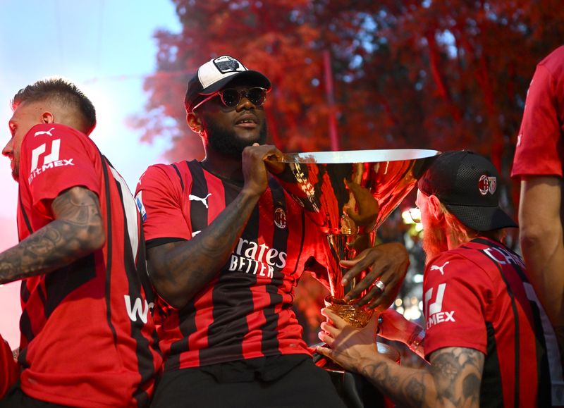 MILAN, ITALY - MAY 23: Franck Kessie Players of AC Milan celebrate with fans victory parade of 