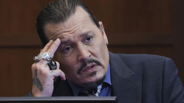Actor Johnny Depp testifies in the courtroom in the Fairfax County Circuit Courthouse in Fairfax, Va., Wednesday, May 25, 2022. Depp sued his ex-wife Amber Heard for libel in Fairfax County Circuit Court after she wrote an op-ed piece in The Washington Post in 2018 referring to herself as a 