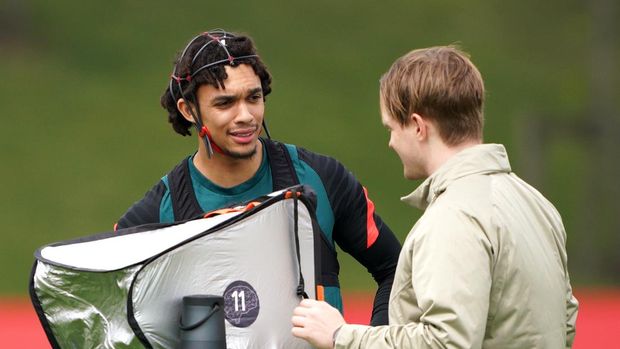 Liverpool's Trent Alexander-Arnold (left) wearing a neuro-headset and backpack during a media day at the AXA Training Centre in Liverpool ahead of the UEFA Champions League Final in Paris on Saturday. Picture date: Wednesday May 25, 2022. (Photo by Peter Byrne/PA Images via Getty Images)