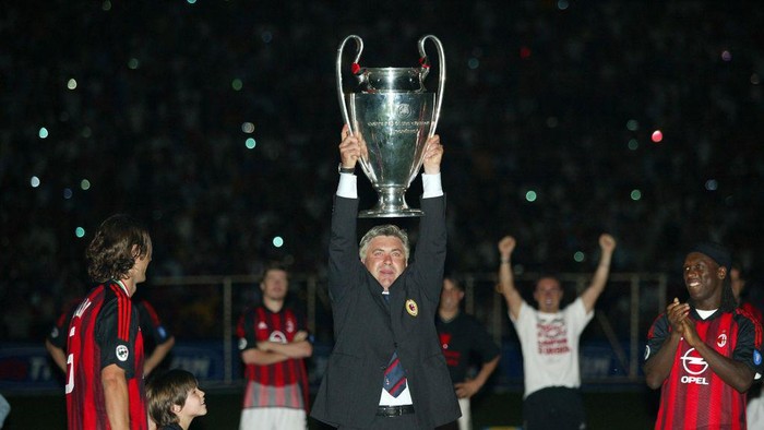 MILAN,ITALY - MAY 2003: Carlo Ancelotti head coach of AC Milan poses for photo with the Uefa Champions League trophy 2002-2003 in Milan on Stadio San Siro, Italy. (Photo by Alessandro Sabattini/Getty Images)
