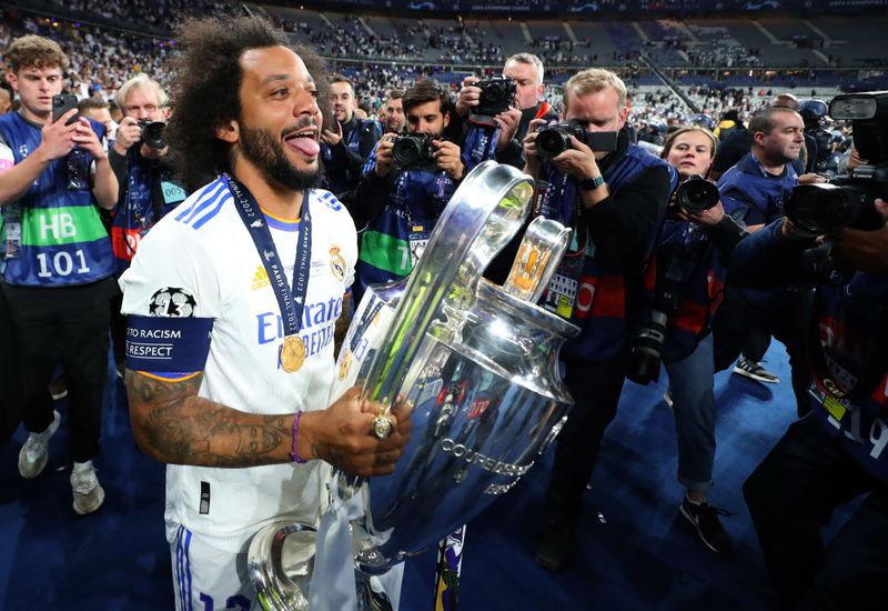 PARIS, FRANCE - MAY 28: Marcelo of Real Madrid holds the UEFA Champions League trophy during the UEFA Champions League final match between Liverpool FC and Real Madrid at Stade de France on May 28, 2022 in Paris, France. (Photo by Alex Livesey - Danehouse/Getty Images)