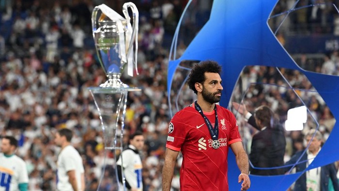 TOPSHOT - Liverpools Egyptian midfielder Mohamed Salah reacts during the medal ceremony at the end of the UEFA Champions League final football match between Liverpool and Real Madrid at the Stade de France in Saint-Denis, north of Paris, on May 28, 2022. - Real Madrid claimed a 14th European Cup after beating Liverpool 1-0 in the Champions League final at the Stade de France, in France. (Photo by Paul ELLIS / AFP) (Photo by PAUL ELLIS/AFP via Getty Images)
