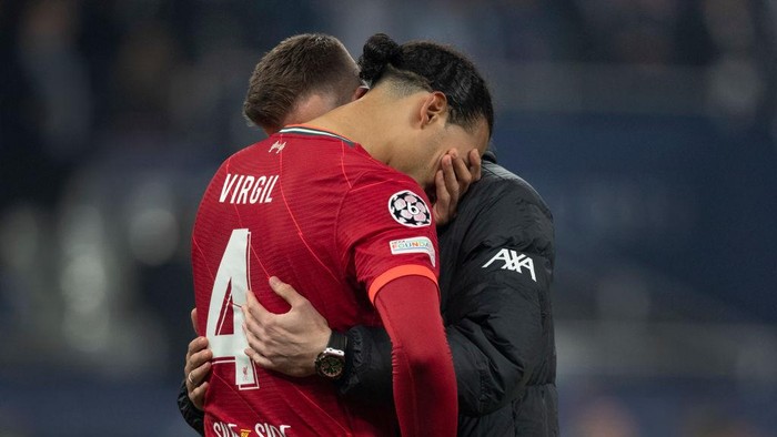 PARIS, FRANCE - MAY 28: Adrian of Liverpool consoles team mate Virgil van Dijk after the UEFA Champions League final match between Liverpool FC and Real Madrid at Stade de France on May 28, 2022 in Paris, France. (Photo by Visionhaus/Getty Images)