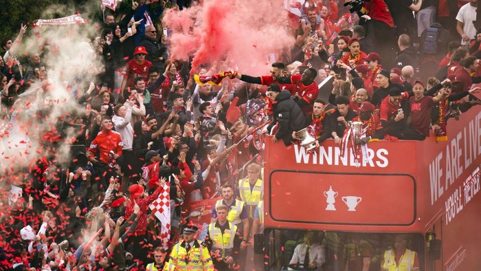 Liverpool fans celebrate as the mens team bus goes past during the trophy parade in Liverpool. Picture date: Sunday May 29, 2022. (Photo by Danny Lawson/PA Images via Getty Images)