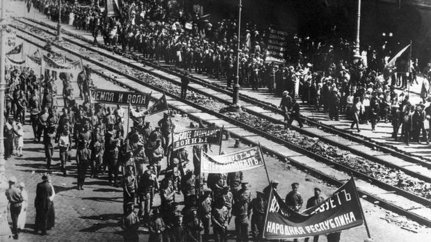 Picture dated 1917 showing people demonstrating in Moscow. March 1917 Russian Revolution started with demonstrations against the war and the food supply shortages in Petrograd and led to the abdication of Tsar Nicholas II. During the October 1917 Revolution, the Bolsheviks overthrew the Kerensky's Provisional Government, formed in March 1917, and replaced it for a soviet one, leading to the establishment of the Soviet Union. The October Revolution was led by Vladimir Lenin and Leon Trotsky, and marked the beginning of the spread of communism in the twentieth century. (Photo by TASS / AFP)