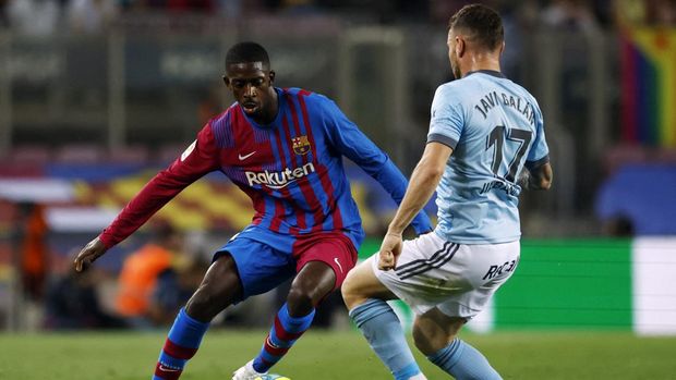 Soccer Football - LaLiga - FC Barcelona v Celta Vigo - Camp Nou, Barcelona, Spain - May 10, 2022 FC Barcelona's Ousmane Dembele in action with Celta Vigo's Javi Galan REUTERS/Albert Gea