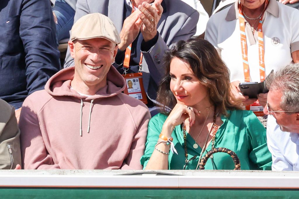TOPSHOT - French football coach and former player Zinedine Zidane (R) and his wife Veronique watch from a balcony the  Monaco Formula 1 Grand Prix at the Monaco street circuit in Monaco, on May 29, 2022. (Photo by CHRISTIAN BRUNA / POOL / AFP) (Photo by CHRISTIAN BRUNA/POOL/AFP via Getty Images)
