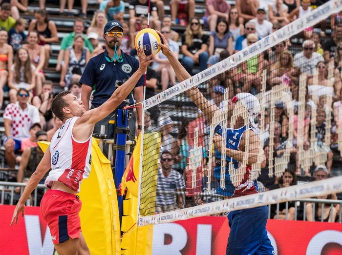 POREC, CROATIA - JUNE 30: Ivan Perisic of Croatia and Inter Milan spikes the ball during the match against Jake Gibb and Taylor Crabb of the United States during the second stage of the Swatch Beach Volleyball Major Series on June 30, 2017 in Porec, Croatia.