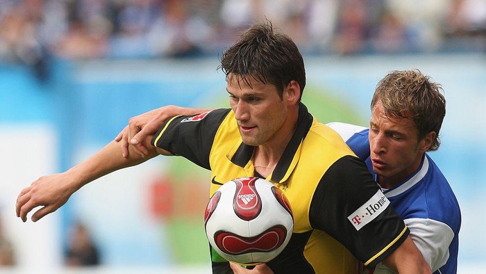 Philipp Degen ROSTOCK, GERMANY - SEPTEMBER 01: Philipp Degen (L) of Dortmund vies for the ball with Tobias Rathgeb (R) of Rostock during the Bundesliga match between Hansa Rostock and Borussia Dortmund at the easyCredit Stadium on September 1, 2007 in Rostock, Germany. (Photo by Sean Gallup/Bongarts/Getty Images)