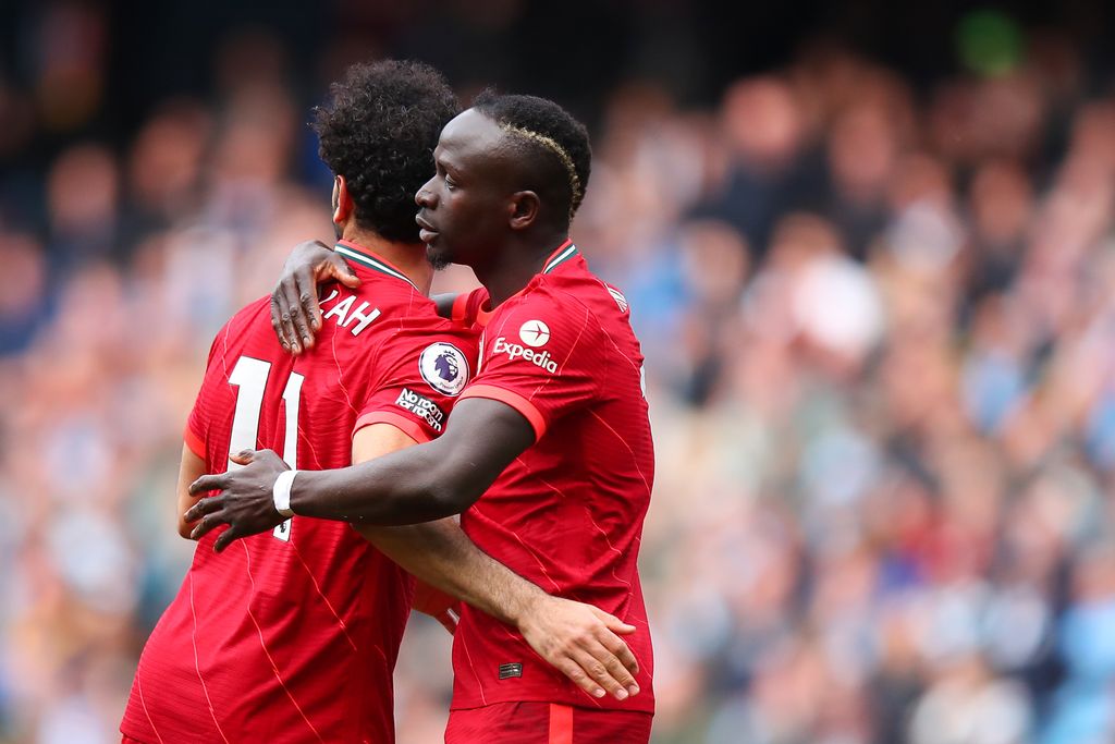 MANCHESTER, ENGLAND - APRIL 10: Sadio Mane of Liverpool celebrates after scoring a goal to make it 2-2 with Mo Salah during the Premier League match between Manchester City and Liverpool at Etihad Stadium on April 10, 2022 in Manchester, United Kingdom. (Photo by Robbie Jay Barratt - AMA/Getty Images)