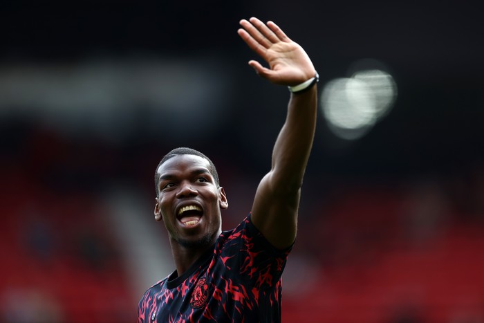 MANCHESTER, ENGLAND - APRIL 16: Paul Pogba of Manchester United warms up ahead of the Premier League match between Manchester United and Norwich City at Old Trafford on April 16, 2022 in Manchester, England. (Photo by Manchester United/Manchester United via Getty Images)