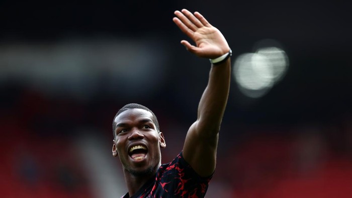 MANCHESTER, ENGLAND - APRIL 16: Paul Pogba of Manchester United warms up ahead of the Premier League match between Manchester United and Norwich City at Old Trafford on April 16, 2022 in Manchester, England. (Photo by Manchester United/Manchester United via Getty Images)