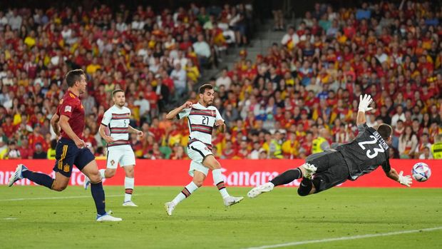 SEVILLE, SPAIN - JUNE 02: Ricardo Horta of Portugal scores their team's first goal past Unai Simon of Spain  during the UEFA Nations League League A Group 2 match between Spain and Portugal at Estadio Benito Villamarin on June 02, 2022 in Seville, Spain. (Photo by Angel Martinez - UEFA/UEFA via Getty Images)