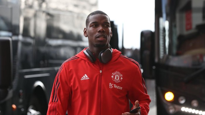 MANCHESTER, ENGLAND - APRIL 02: Paul Pogba of Manchester United arrives ahead of the Premier League match between Manchester United and Leicester City at Old Trafford on April 02, 2022 in Manchester, England. (Photo by Tom Purslow/Manchester United via Getty Images)