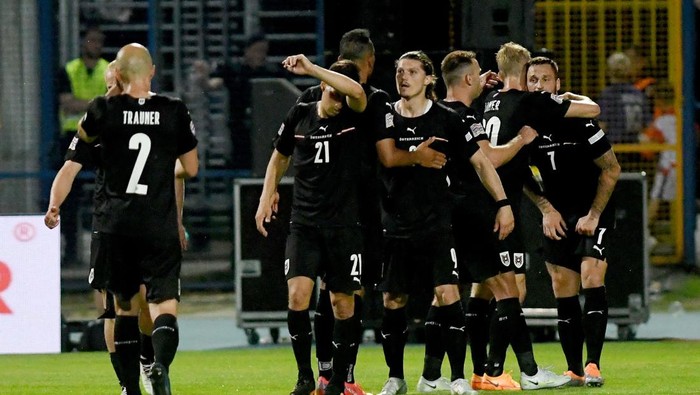 Austrias players celebrate after scoring a goal during the UEFA Nations League football match between Croatia and Austria at the Gradski stadium in Osijek, on June 3, 2022. (Photo by Denis LOVROVIC / AFP) (Photo by DENIS LOVROVIC/AFP via Getty Images)