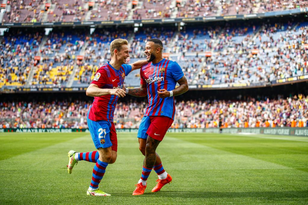 09 Memphis Depay of FC Barcelona celebrating his goal with 21 Frenkie De Jong of FC Barcelona during the La Liga Santader match between FC Barcelona and Getafe CF at Camp Nou Stadium on August 29, 2021 in Barcelona. (Photo by Xavier Bonilla/NurPhoto via Getty Images)
