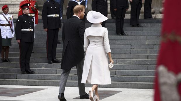 Prince Harry and Meghan Markle, Duke and Duchess of Sussex leave after a service of thanksgiving for the reign of Queen Elizabeth II at St Paul's Cathedral in London, Friday, June 3, 2022 on the second of four days of celebrations to mark the Platinum Jubilee. The events over a long holiday weekend in the U.K. are meant to celebrate the monarch's 70 years of service. (AP Photo/Matt Dunham, Pool)