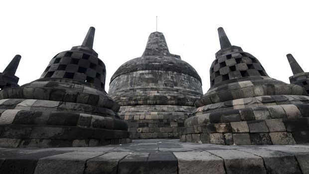 This picture taken on May 10, 2016 shows Buddhist stupas at the ancient Borobudur temple in Magelang, in Indonesia's central Java province. - For centuries, Borobudur lay hidden under layers of volcanic ash until restoration program undertaken between 1973 and 1984 returned much of the complex to its former glory, and the site has since become a destination of Buddhist pilgrimage. (Photo by GOH CHAI HIN / AFP)