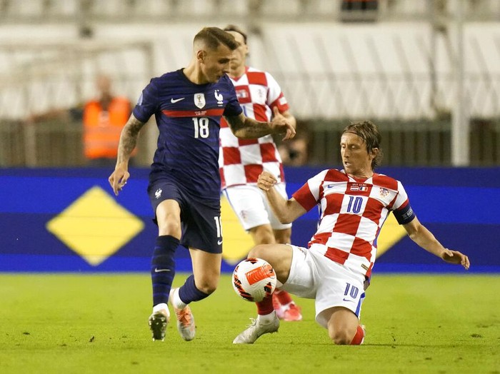 France's Aurelien Tchouameni, left, jumps for the ball with Croatia's Mateo Kovacic during the UEFA Nations League soccer match between Croatia and France at the Poljud stadium, in Split, Croatia, Monday, June 6, 2022. (AP Photo/Darko Bandic)