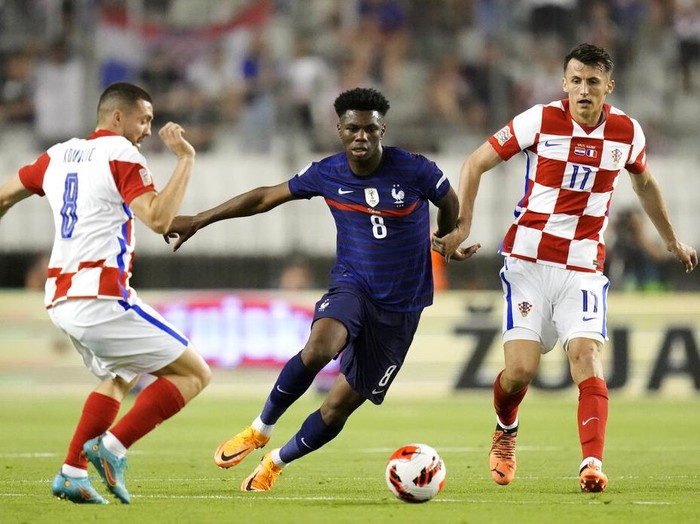 France's Aurelien Tchouameni, left, jumps for the ball with Croatia's Mateo Kovacic during the UEFA Nations League soccer match between Croatia and France at the Poljud stadium, in Split, Croatia, Monday, June 6, 2022. (AP Photo/Darko Bandic)
