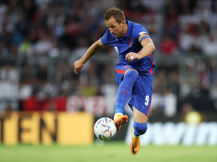 MUNICH, GERMANY - JUNE 07: Harry Kane of England controls the ball during the UEFA Nations League League A Group 3 match between Germany and England at Allianz Arena on June 07, 2022 in Munich, Germany. The German national team will play the match in the Women’s national kit in support of their upcoming UEFA Women’s European Championship campaign. (Photo by Alex Grimm/Getty Images)