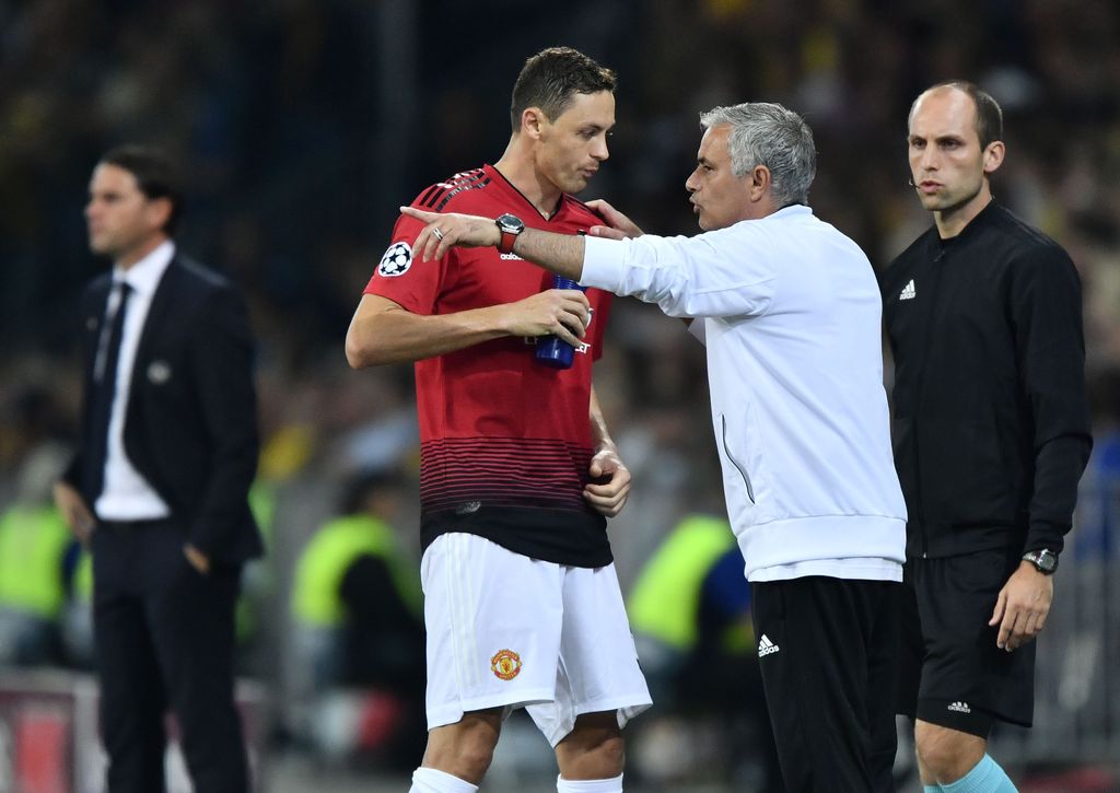 Manchester United's Portuguese manager Jose Mourinho (R) gestures as he speaks with Manchester United's Serbian midfielder Nemanja Matic during the UEFA Champions League group H football match between Young Boys and Manchester United at The Stade de Suisse in Bern on September 19, 2018. (Photo by Fabrice COFFRINI / AFP)        (Photo credit should read FABRICE COFFRINI/AFP via Getty Images)