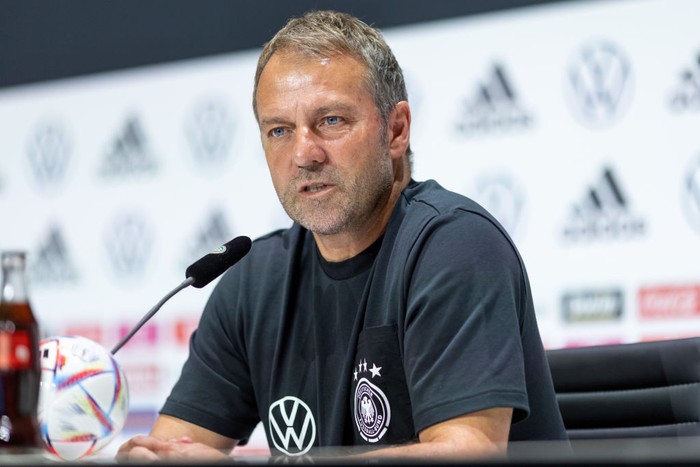10 June 2022, Bavaria, Herzogenaurach: Soccer: National team, before the Nations League match in Hungary. Coach Hansi Flick takes part in a press conference. Photo: Daniel Karmann/dpa - IMPORTANT NOTE: In accordance with the requirements of the DFL Deutsche Fußball Liga and the DFB Deutscher Fußball-Bund, it is prohibited to use or have used photographs taken in the stadium and/or of the match in the form of sequence pictures and/or video-like photo series. (Photo by Daniel Karmann/picture alliance via Getty Images)