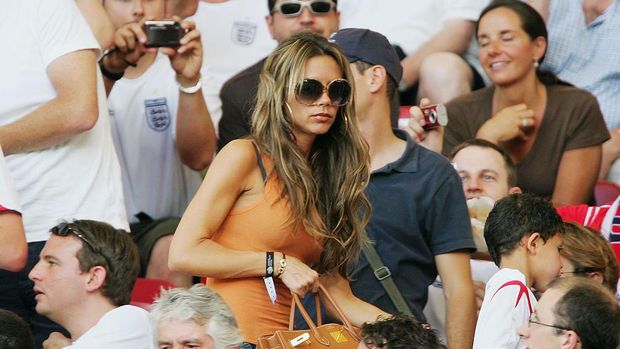 STUTTGART, GERMANY - JUNE 25: Victoria Beckham returns to her seat during the FIFA World Cup Germany 2006 Round of 16 match between England and Ecuador played at the Gottlieb-Daimler Stadium on June 25, 2006 in Stuttgart, Germany. (Photo by Alex Livesey/Getty Images)