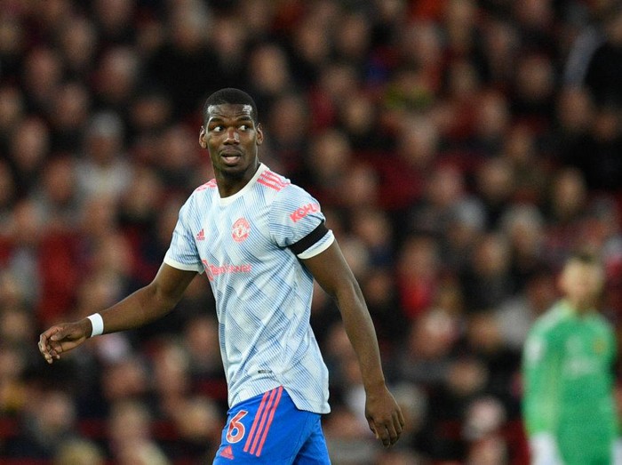 Manchester United's French midfielder Paul Pogba reacts during the English Premier League football match between Liverpool and Manchester United at Anfield in Liverpool, north west England on April 19, 2022. - - RESTRICTED TO EDITORIAL USE. No use with unauthorized audio, video, data, fixture lists, club/league logos or 'live' services. Online in-match use limited to 120 images. An additional 40 images may be used in extra time. No video emulation. Social media in-match use limited to 120 images. An additional 40 images may be used in extra time. No use in betting publications, games or single club/league/player publications. (Photo by Oli SCARFF / AFP) / RESTRICTED TO EDITORIAL USE. No use with unauthorized audio, video, data, fixture lists, club/league logos or 'live' services. Online in-match use limited to 120 images. An additional 40 images may be used in extra time. No video emulation. Social media in-match use limited to 120 images. An additional 40 images may be used in extra time. No use in betting publications, games or single club/league/player publications. / RESTRICTED TO EDITORIAL USE. No use with unauthorized audio, video, data, fixture lists, club/league logos or 'live' services. Online in-match use limited to 120 images. An additional 40 images may be used in extra time. No video emulation. Social media in-match use limited to 120 images. An additional 40 images may be used in extra time. No use in betting publications, games or single club/league/player publications. (Photo by OLI SCARFF/AFP via Getty Images)