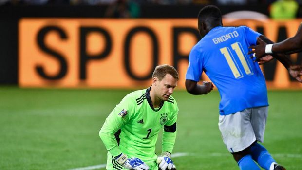 14 June 2022, North Rhine-Westphalia, Mönchengladbach: Soccer: Nations League A, Germany - Italy, Group Stage, Group 3, Matchday 4, Stadion im Borussia-Park, Germany's goalkeeper Manuel Neuer (l) kneels on the ground after Italy's Degnand Wilfried Gnonto (r) scored to make it 5:1 for Germany. Photo: Marius Becker/dpa (Photo by Marius Becker/picture alliance via Getty Images)