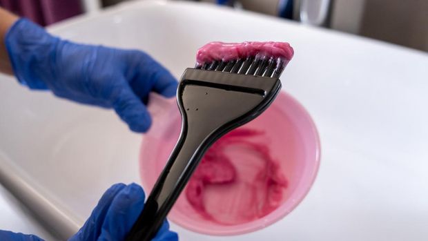 Pink Vibrant Hair Dye Coloring brush Close Up