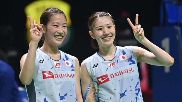 Japan's Nami Matsuyama (L) and Chiharu Shida (R) react after their victory against Japan's Yuki Fukushima and Sayaka Hirota during the womens doubles final at the Indonesia Open badminton tournament in Jakarta on June 19, 2022. (Photo by ADEK BERRY / AFP)