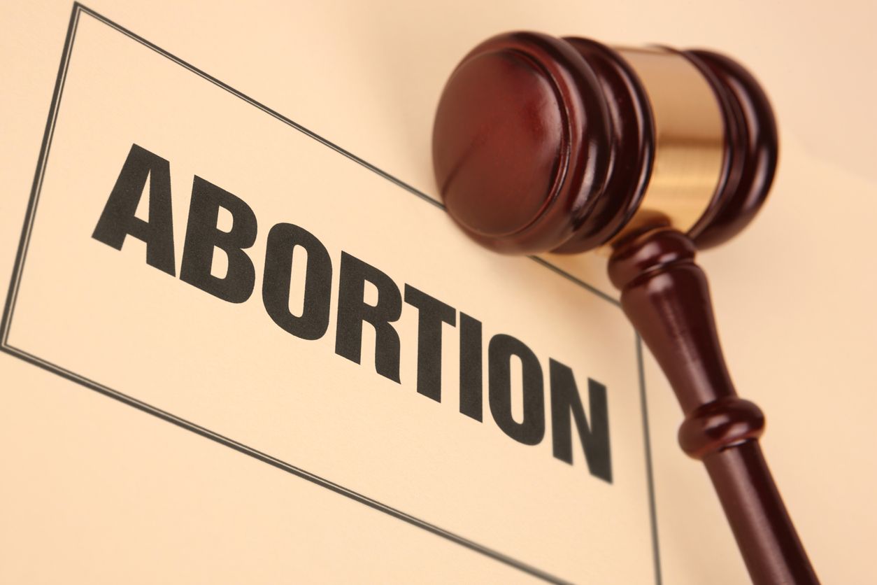 Abortion document near a gavel.  Stock image of justice and law.