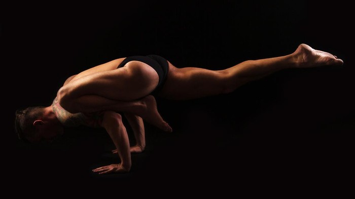 Yoga muscular powerful man practicing yoga asana