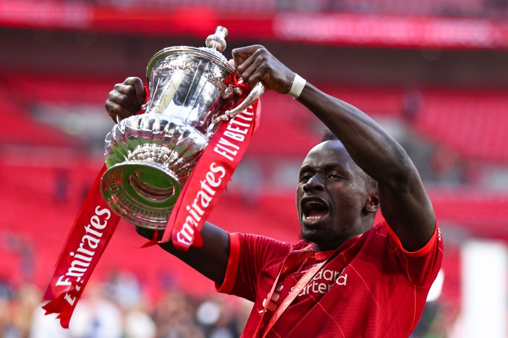 LONDON, ENGLAND - MAY 14: Sadio Mane of Liverpool celebrates with the Emirates FA Cup trophy following his team's victory in The FA Cup Final match between Chelsea and Liverpool at Wembley Stadium on May 14, 2022 in London, England. (Photo by Marc Atkins/Getty Images)